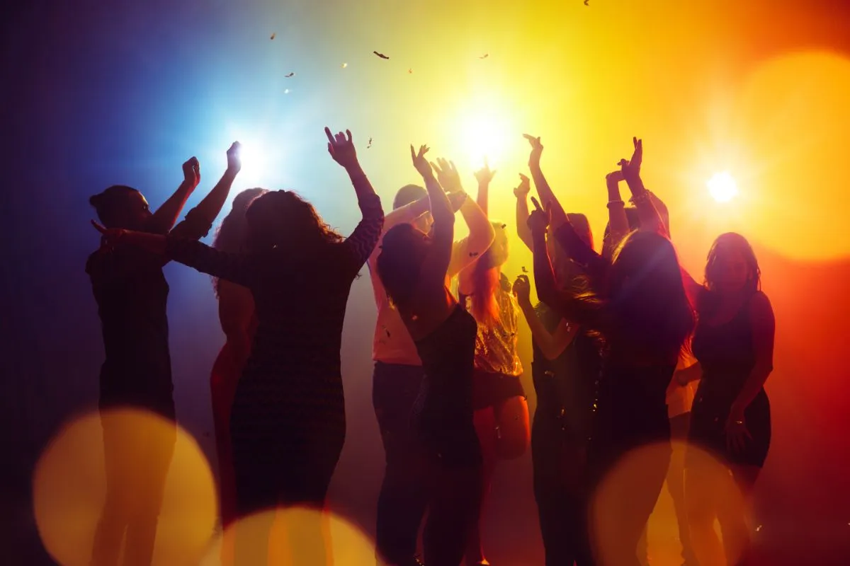 Vancouver Island DJ playing music for people dancing and having fun on dancefloor.